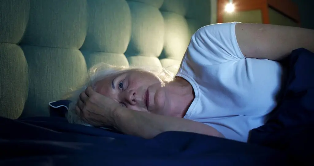 Sensible, knowledgeable recommendation for joint ache, mind fog and frayed nerves 1 Sleep-deprived mature woman feeling frustrated in bed.