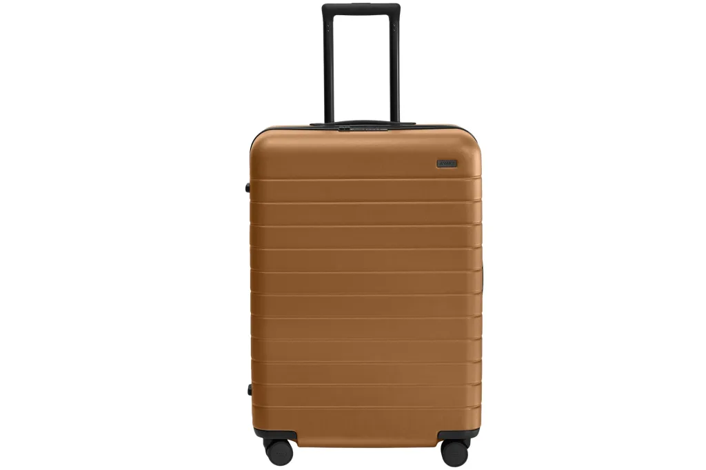What Web page Six Editors Are Actually Shopping for at Nordstrom's Anniversary Sale 11 A gold Away suitcase with a black handle and wheels.