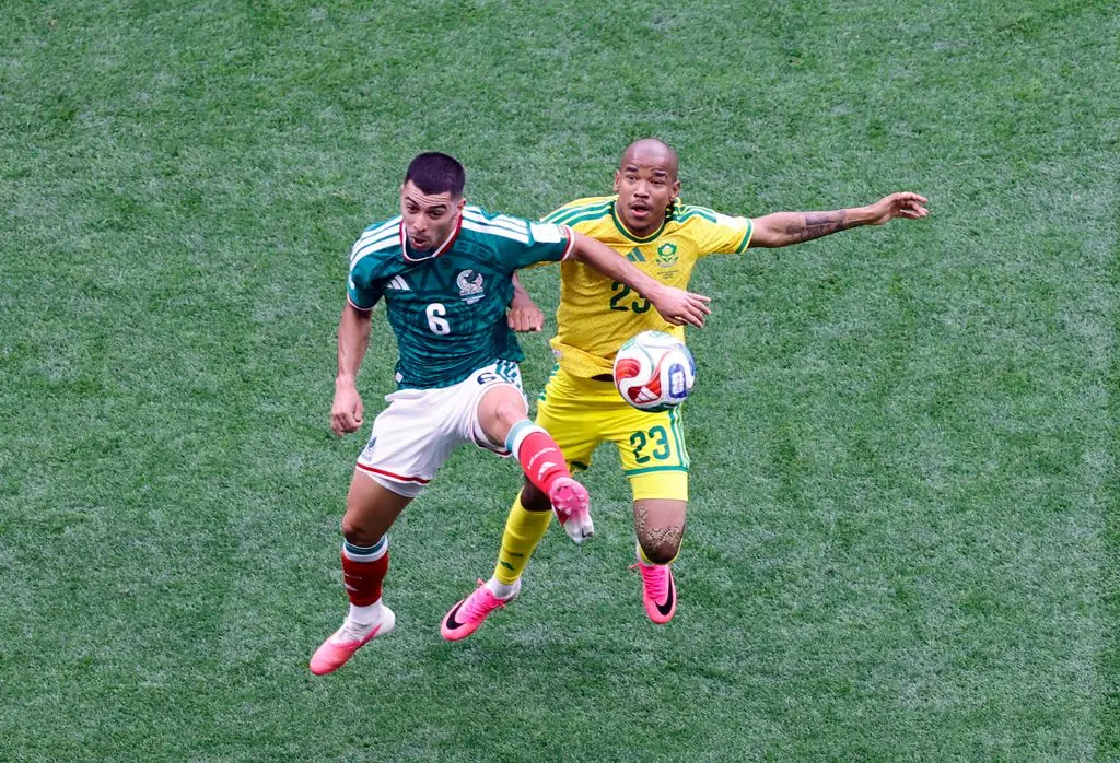 Mexico midfielder #06 Erik Lira and South Africa midfielder #23 Jayden Adams fight for the ball during the 2026 World Cup Group A soccer match 