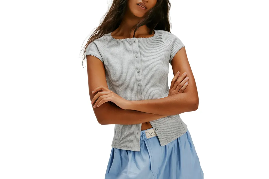 What Web page Six Editors Are Actually Shopping for at Nordstrom's Anniversary Sale 4 A model wearing a gray ribbed button-front top and blue shorts.