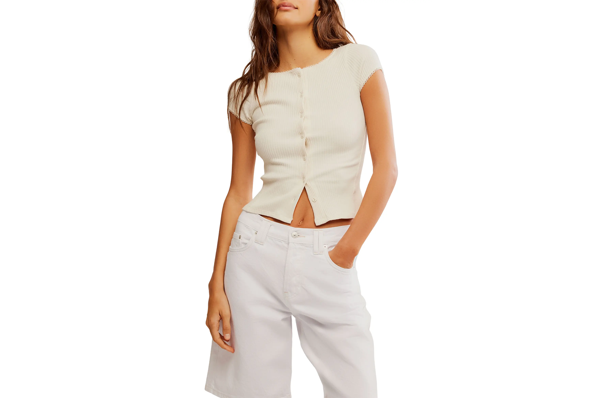 Nordstrom Anniversary Sale Has Nice Free Folks Offers 5 A woman wearing a cream short-sleeved top and white denim shorts.