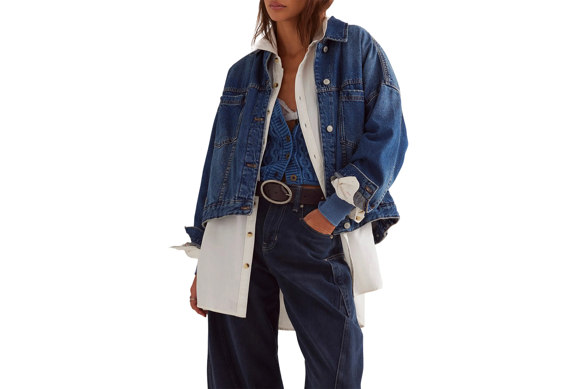Nordstrom Anniversary Sale Has Nice Free Folks Offers 4 A person wearing a denim jacket over a white collared shirt, a blue knit cardigan and dark jeans with a black belt.