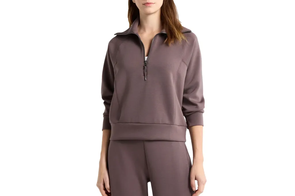 What Web page Six Editors Are Actually Shopping for at Nordstrom's Anniversary Sale 2 Woman wearing brown half-zip sweatshirt and matching sweatpants.