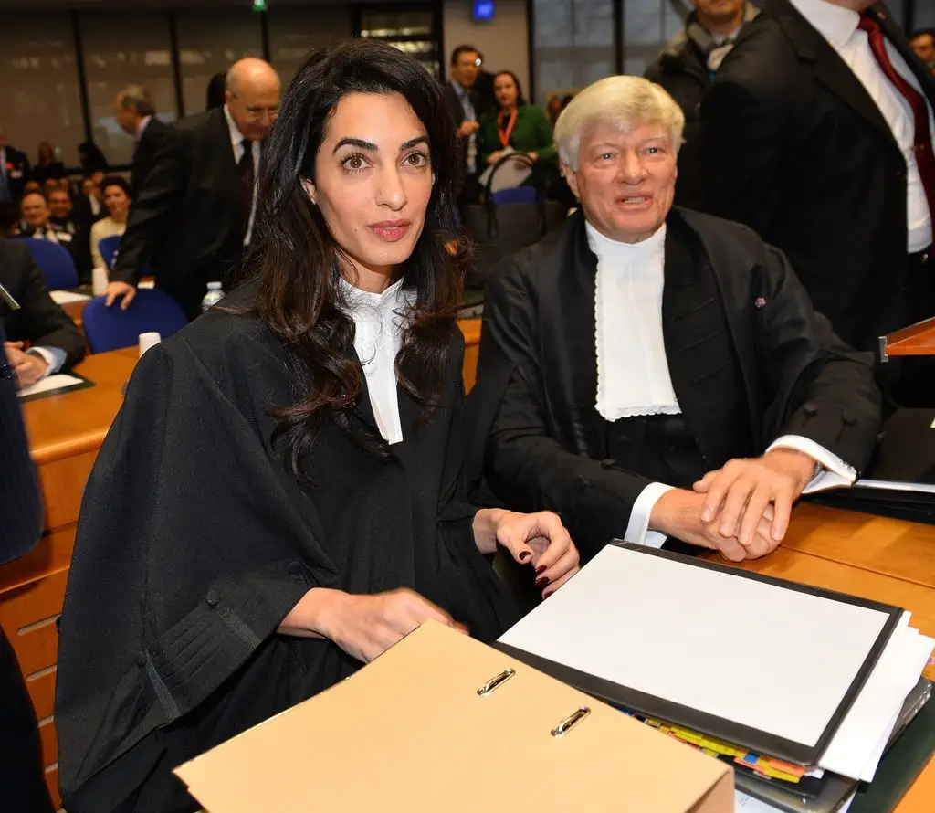 Amal Clooney (left), representing Armenia, is seen January 28, 2015 before the start of the appeal hearing at the European Court of Human Rights.