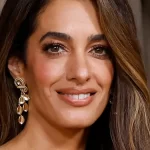 Amal Clooney, 48, shows off toned legs in daring snake print skirt with jaw-dropping slit