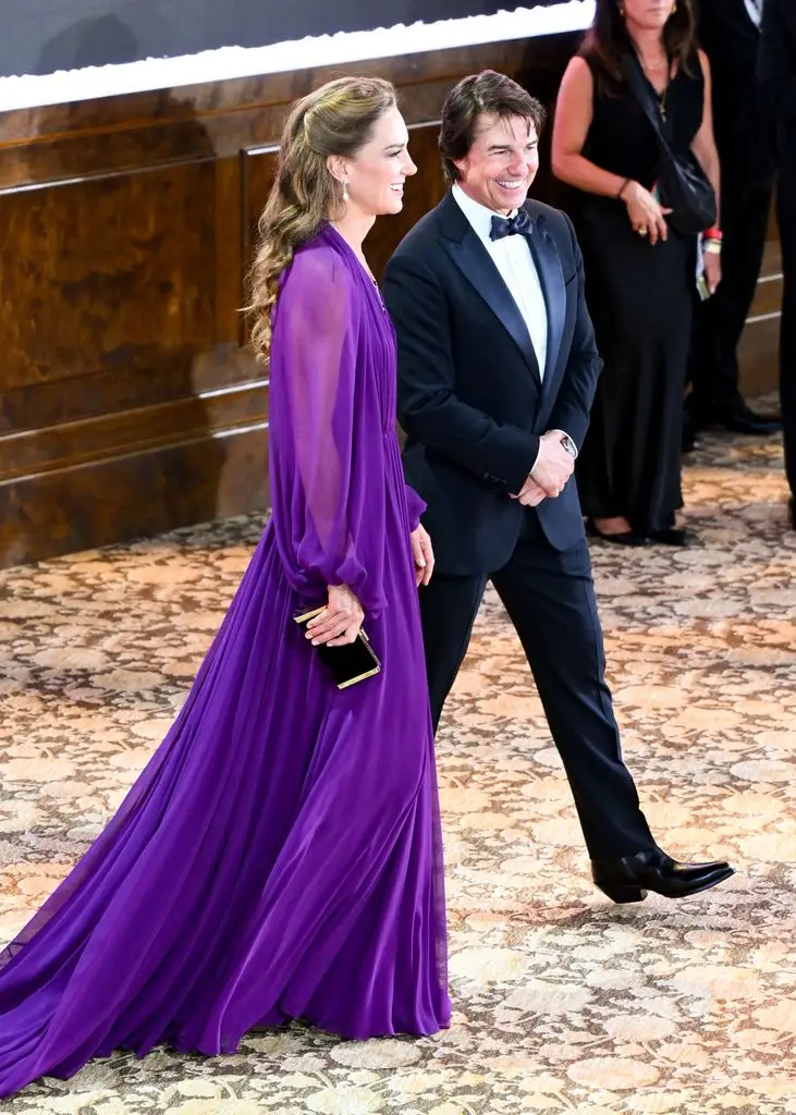 Princess Kate in purple dress walking with Tom Cruise 
