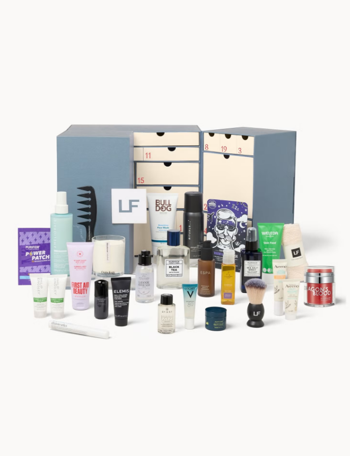     lookfantastic advent calendar, collection of skincare and skincare products arranged on white surface.