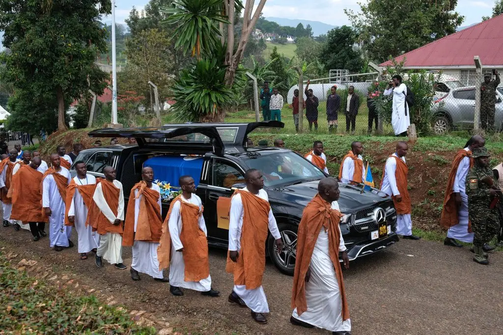FORT PORTAL, UGANDA - SEPTEMBER 12: Royal guards escort the procession with the coffin containing the body of the late King Oyo Nyimba Kabamba Iguru Rukidi IV, to St. John's Cathedral for a requiem mass before his burial at the Karambi Royal Tombs, September 12, 2026 in Fort Portal, Uganda. The official burial takes place for Oyo Nyimba Kabamba Iguru Rukidi IV, a Ugandan traditional ruler of the Tooro Kingdom, who died at the age of 34 on August 27, 2026, while being treated for a serious illness in the United States. Following the king's death, a dispute arose between the monarch's family and the succession committee over who should succeed him. (Photo by Hajarah Nalwadda/Getty Images)