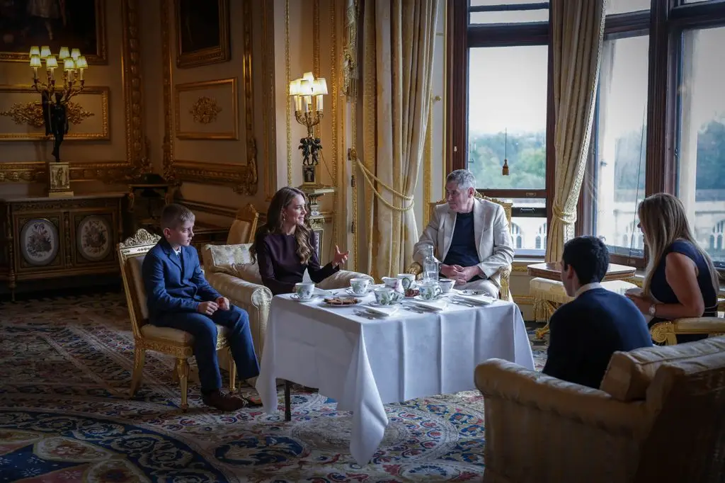 The royal sat and chatted with guests over tea and cake
