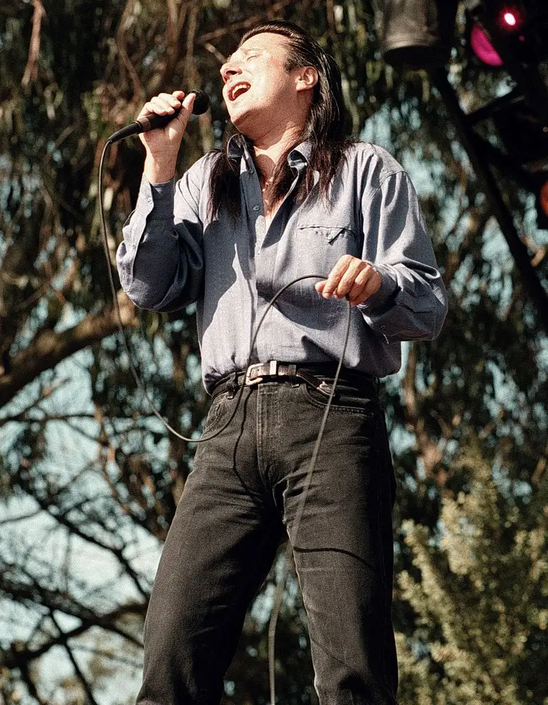 What occurred to Do not Cease Believin' singer Steve Perry? In his solitary life, removed from the highlight 1 Steve Perry singing on stage, holding a microphone, wearing a blue shirt and black jeans.