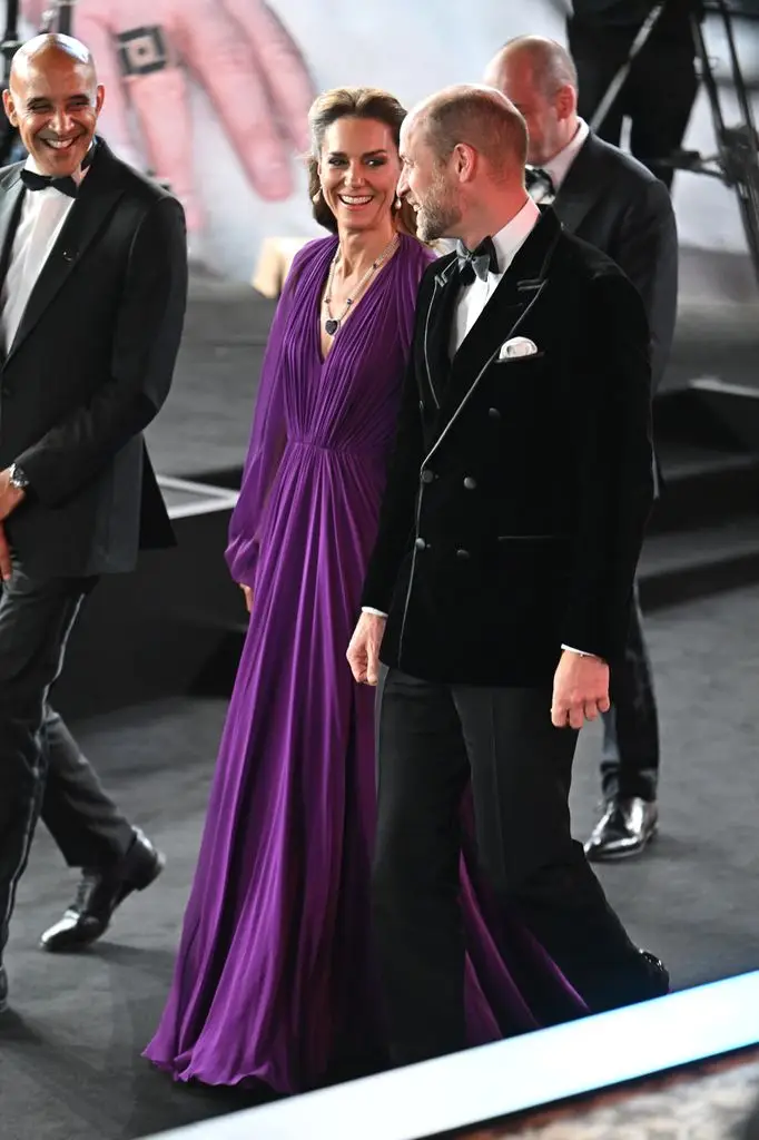 William and Kate look at each other as they get dressed for the premiere