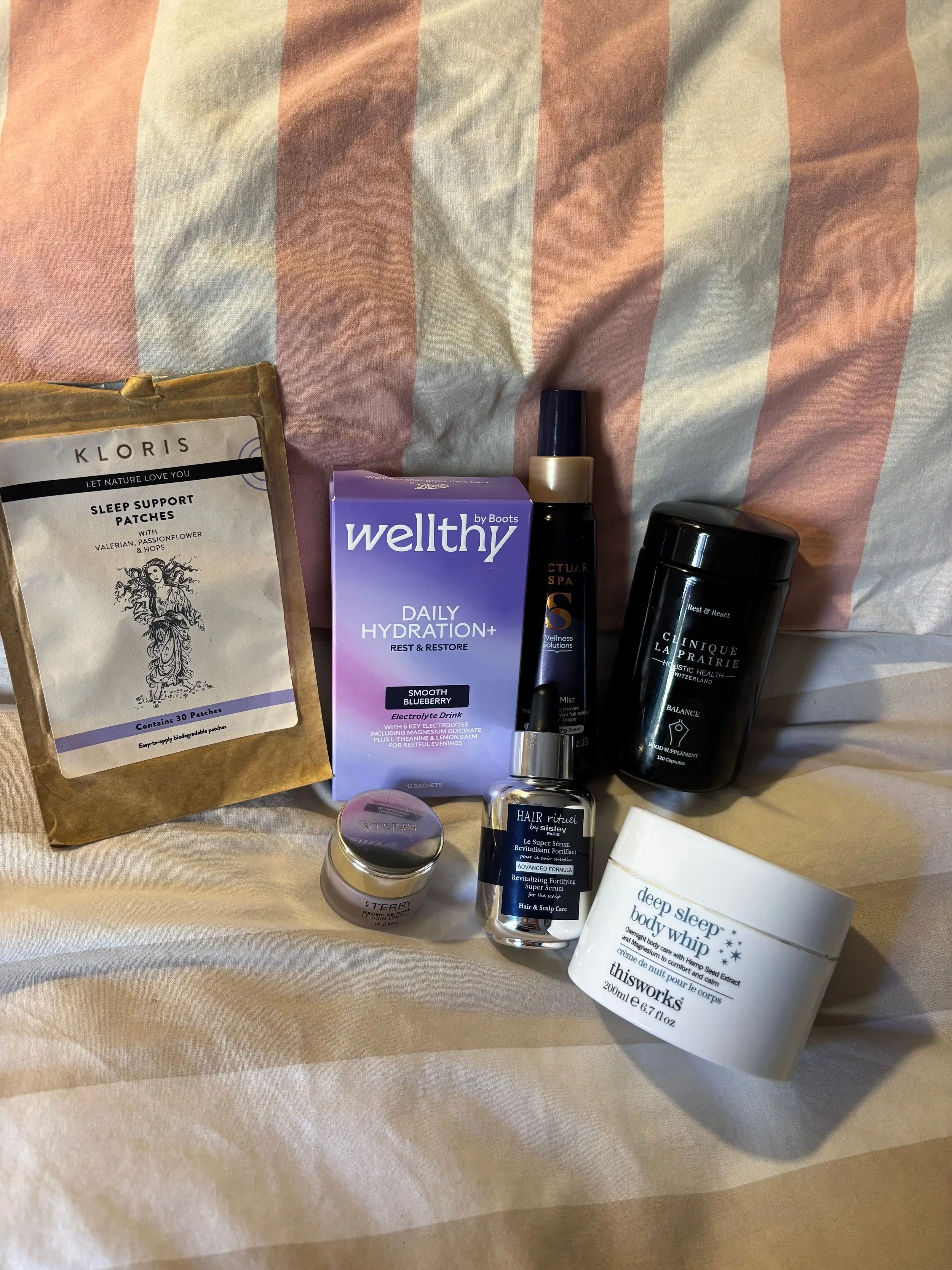 My Oura Sleep Rating remains to be above 85 4 products for sleeping on a striped bed
