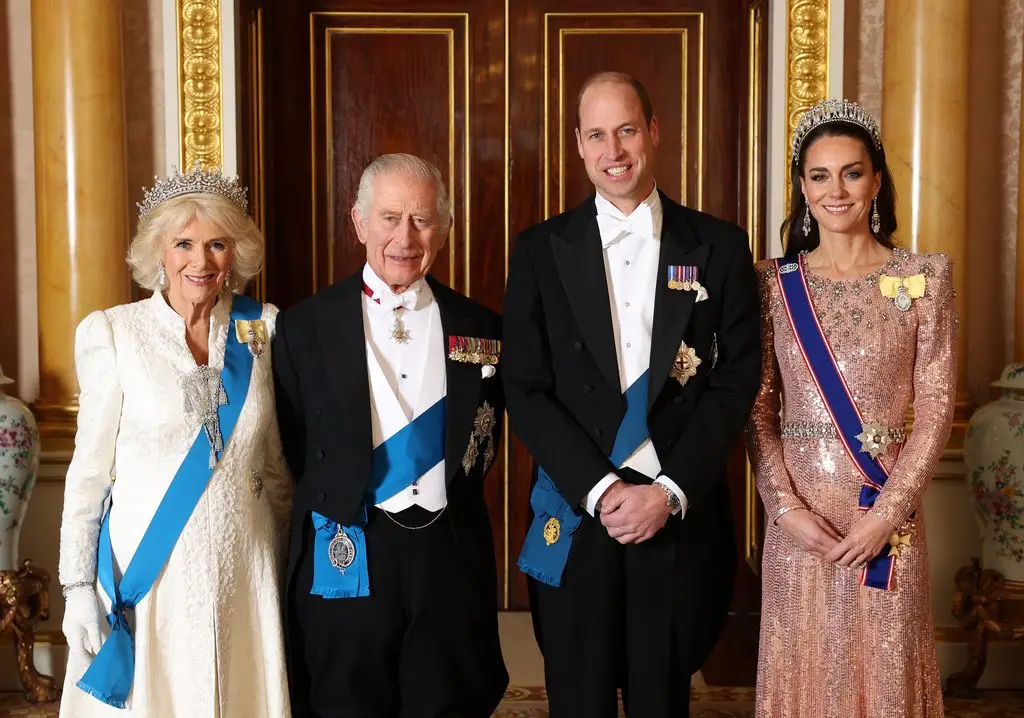 Queen Camilla, King Charles III, Prince William, Prince of Wales and Catherine, Princess of Wales, pose for a photo before the diplomatic reception in Room 1844 at Buckingham Palace on December 5, 2023.