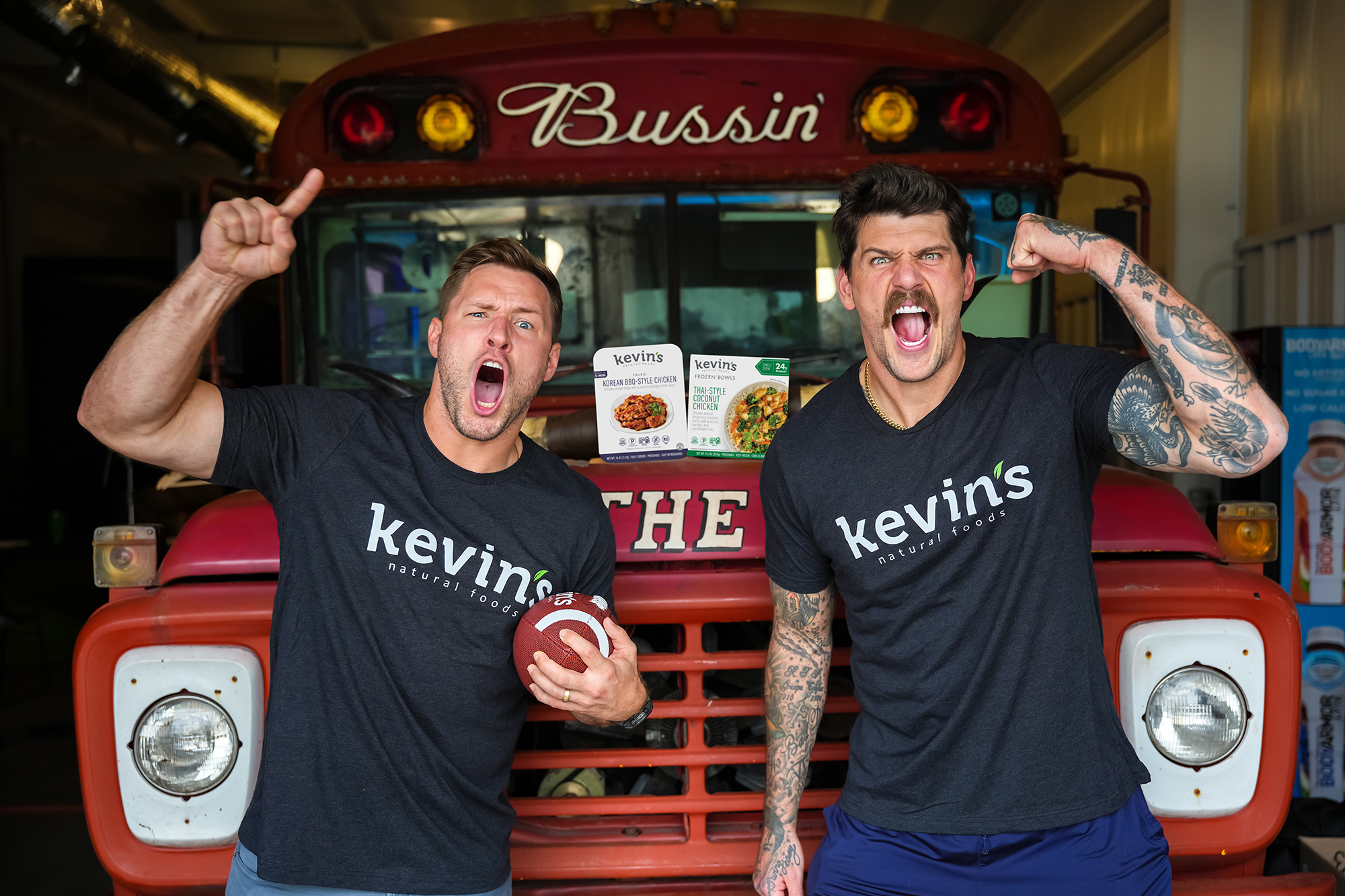 Bussin' with the Boys hosts Will Compton and Taylor Lewan hit the road with Kevin's Natural Foods for the Sauce Showdown, a flavor rivalry pitting Will's Cilantro Lime Sauce against Taylor's Teriyaki Sauce, with fans tasting and voting for their favorite at stops throughout the season on September 17, 2026.