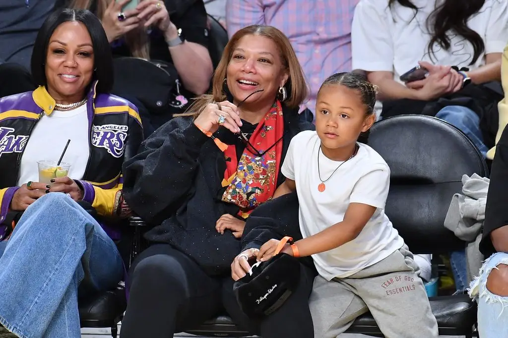 Queen Latifah's Hardly ever Seen Son Insurgent Steals the Present in Lovable Household Second 2 Eboni Nichols and Queen Latifah, rebel sons, basketball game