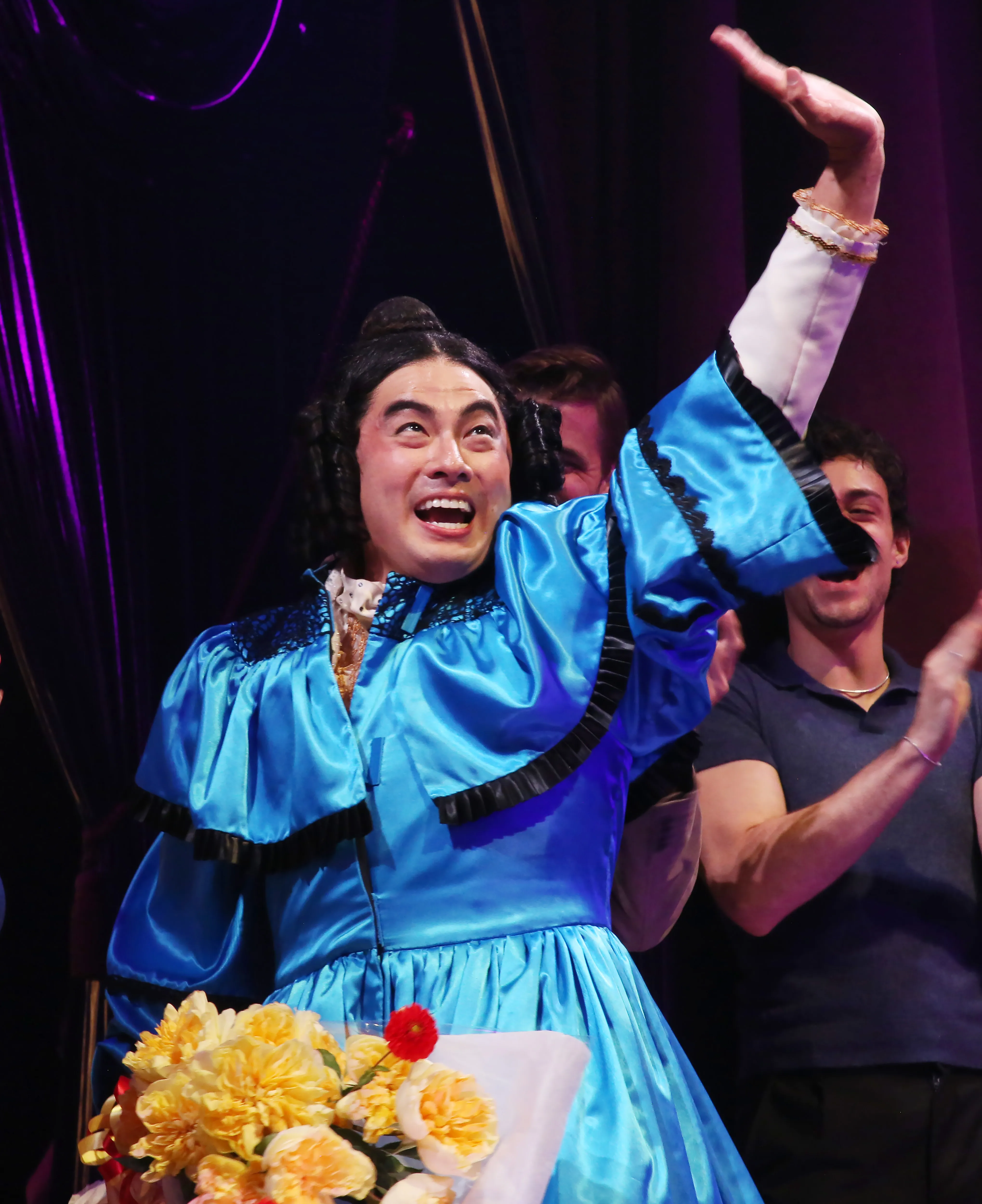 Bowen Yang as Mary Todd Lincoln in the play "O Mary!" greeting the audience.