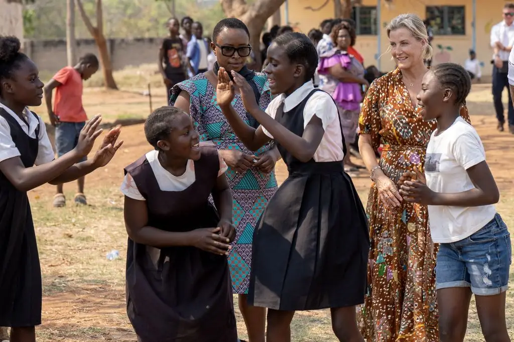 Duchess Sophie, 61, strikes gold in a cascading autumn gown that turned heads 3 The Duchess of Edinburgh watches young people take part in sporting and recreational activities offered by Sport in Action