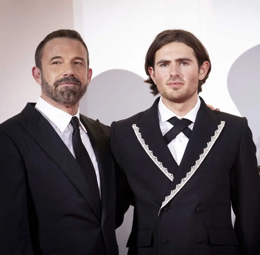 Ben Affleck and Indiana Affleck in suits on the red carpet