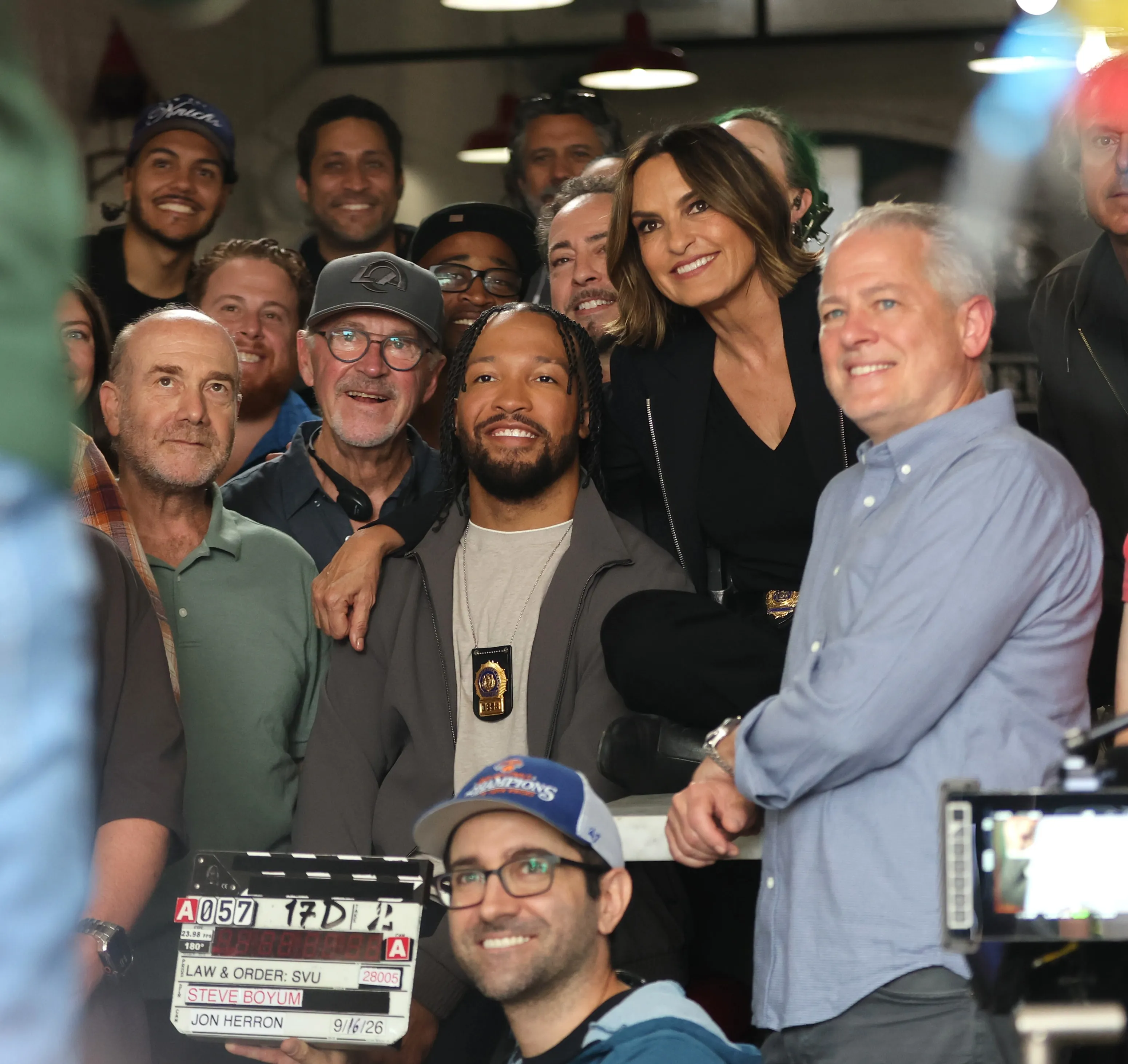 Mariska Hargitay and Jalen Brunson pose with the crew on the set of "Law and Order: Special Victims Unit".