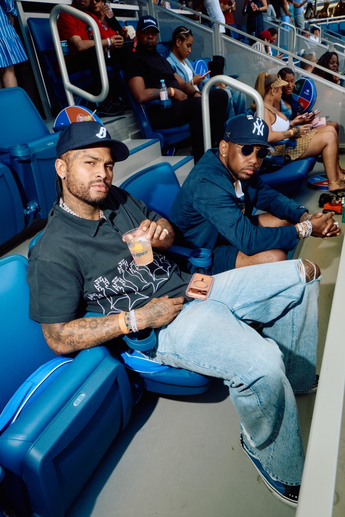 Dave East and Fabolous sitting in the stands at the US Open.