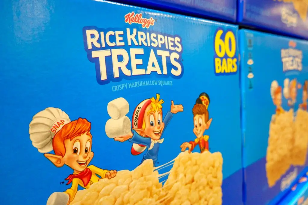 Close-up of a box of Kellogg's Rice Krispies treats featuring the mascots Snap, Crackle and Pop, for sale at a Costco warehouse.