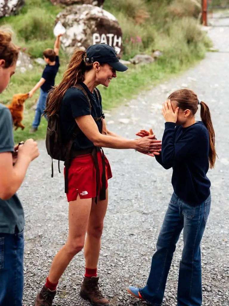 In one photo, Kate hugged her daughter Princess Charlotte, 11, while Louis, eight, could be seen throwing his hands in the air.