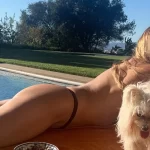 Guess the topless girl with her puppies