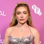 Florence Pugh stuns in plunging silver corset dress as she makes red carpet debut with boyfriend