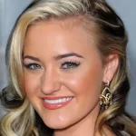 Goldbergs star AJ Michalka flaunts curvaceous physique in stylish black swimsuit while vacationing abroad