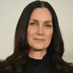 The Matrix Star Carrie-Anne Moss on Natural Aging, Keanu Reeves and His Seductive New Role – Exclusive