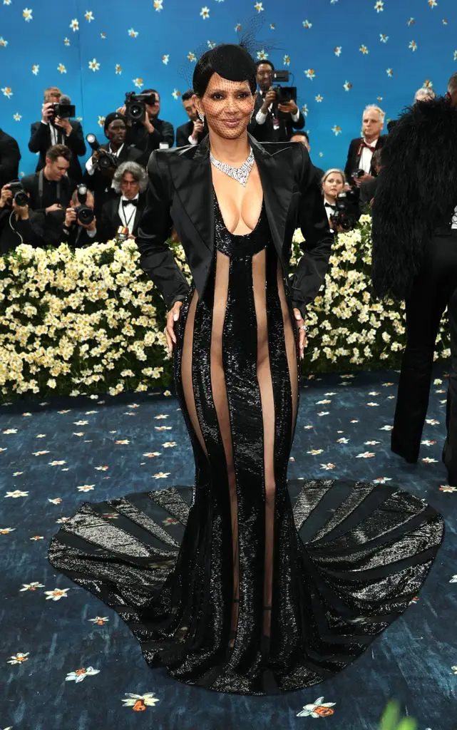 Halle Berry wears a long black fishnet dress
