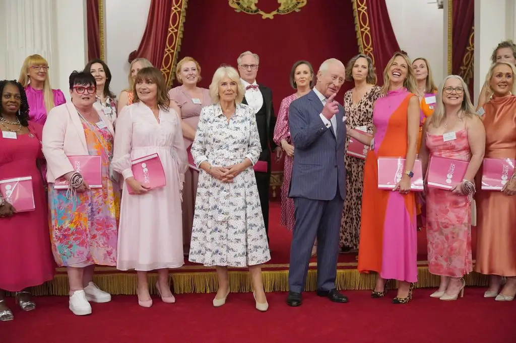 King Charles and Queen Camilla with a group of women, including Lorraine Kelly
