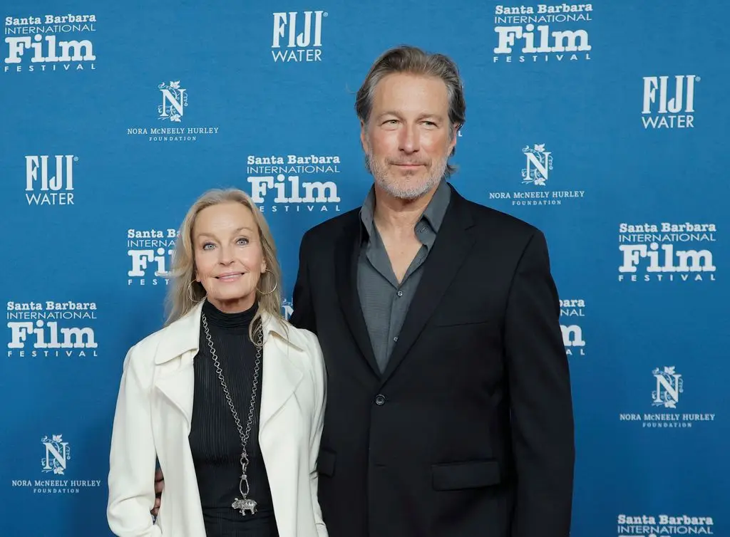 John with his long-time partner Bo Derek