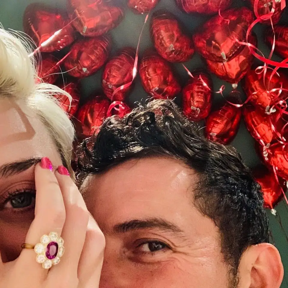 Katy Perry and Orlando Bloom corner facial with ring in view